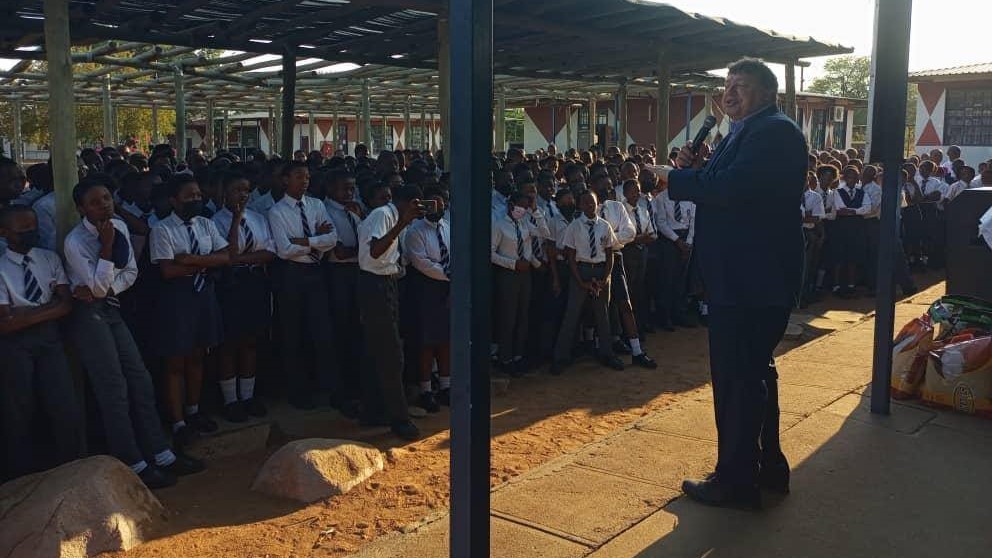 Rob speaking to a school assembly